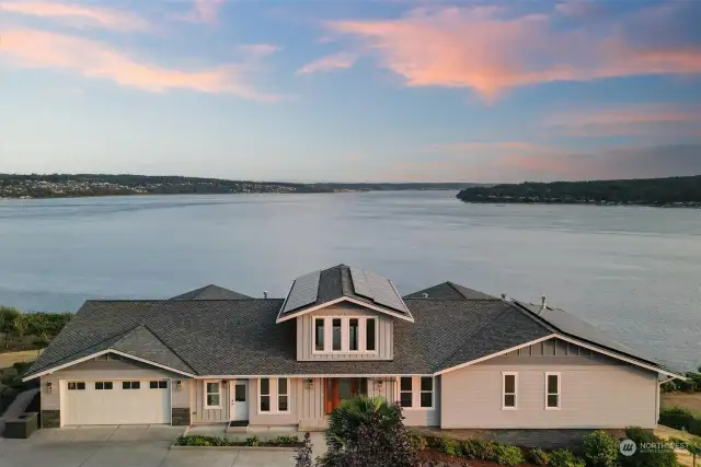 This custom home was built to capture sunrises and sunsets with views from Mt. Rainier to the majestic Olympic Mountains.