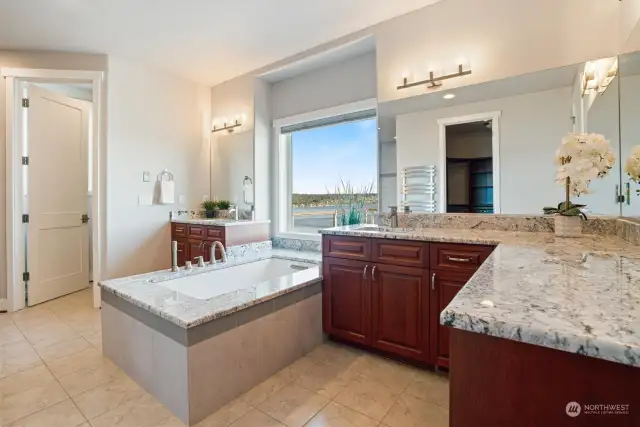 Double vanities are perfect for giving each partner their own space. No lack of storage in this bathroom. Multiple cabinets and drawers give you plenty of places for all your personal care items. Heated tile floors are such a bonus. No cold floors after your warm bath or shower.