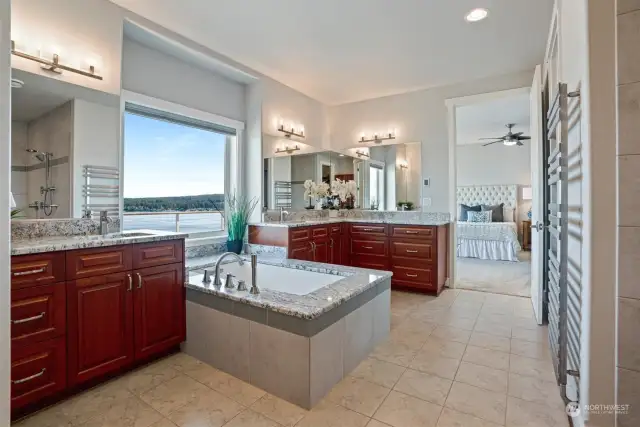 Double closets with built-ins and a magnificent no-step entry shower round out this stunning bathroom. The private water closet is just to the left of this picture.