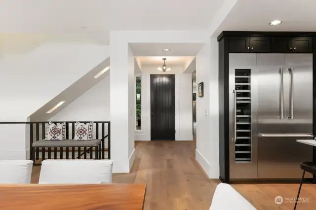 view from dining area to front door and entry hall