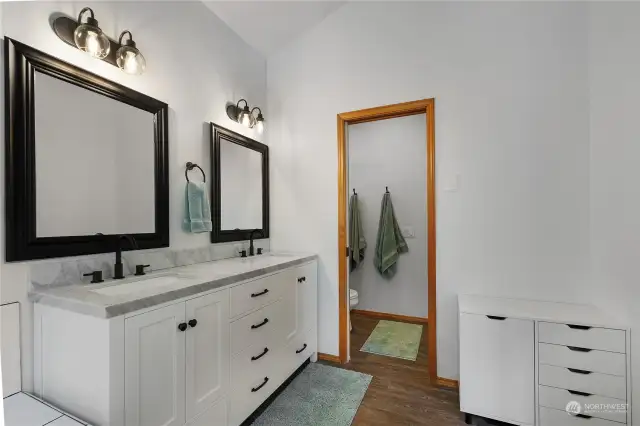 New mirrors, lighting, tile, flooring, vanity, sinks, and fixtures