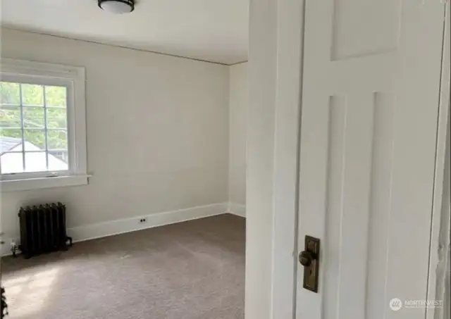 Unit 3 - Second bedroom with walk-in closet on the main floor of the unit.