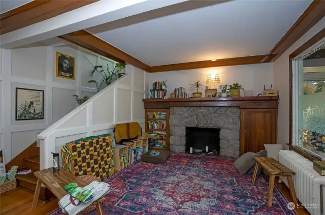 Main living area for Unit #2 features a wood burning fireplace, large windows and beautiful fir flooring. Unit 2 has a washer/dryer, 2 bedrooms, and one 3/4 bathroom.