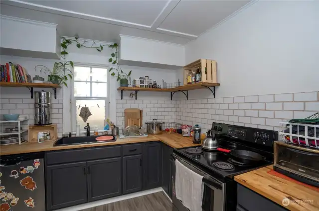 Unit 2 - Large, open kitchen with butcher block countertops.