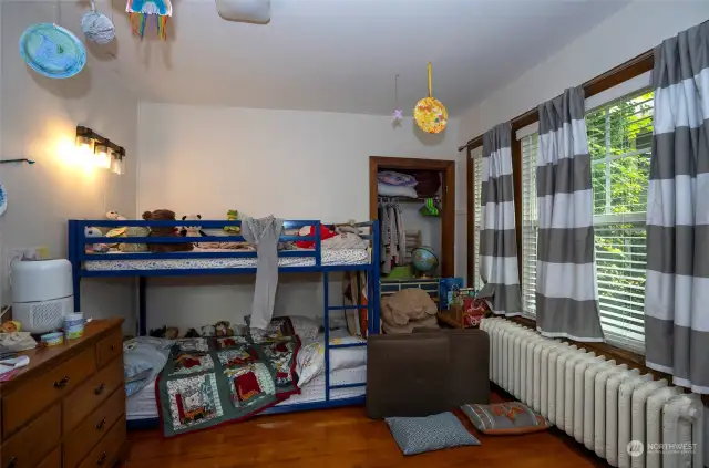 Unit 2 - Spacious second bedroom that features built in wood storage.