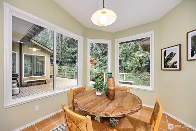 Kitchen area looking out to the deck. Sunroom is directly across.