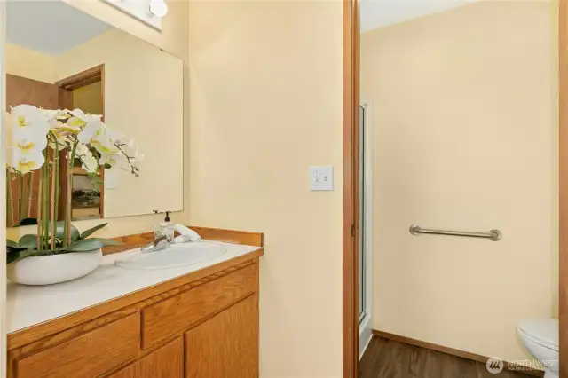 Separate room with shower and toilet off primary bath