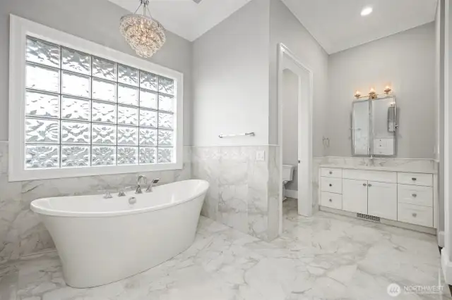 Marble throughout the primary bathroom