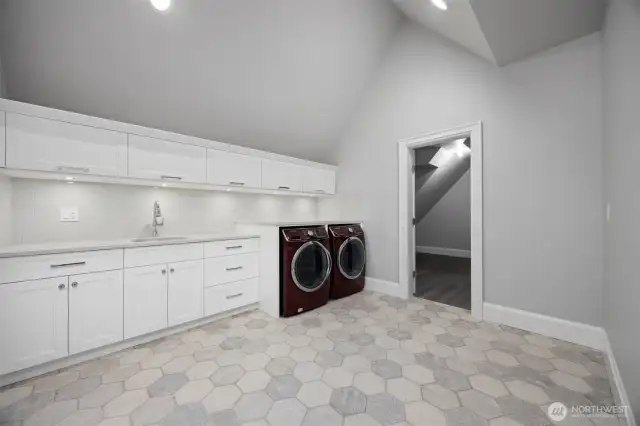 Massive laundry room upstairs with plenty of storage. Another identical laundry room on the main.