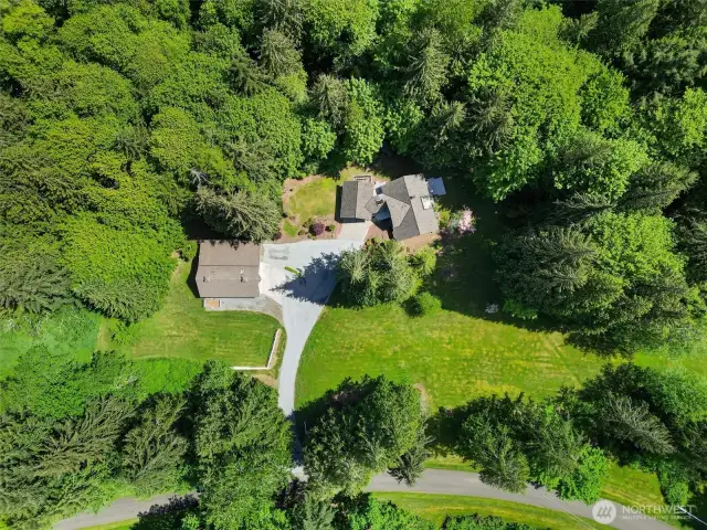 Welcome to Lord Hill! This stunning home is nestled on a private 5-acre lot, featuring a 1,144 sq ft detached garage/shop and additional covered RV parking.