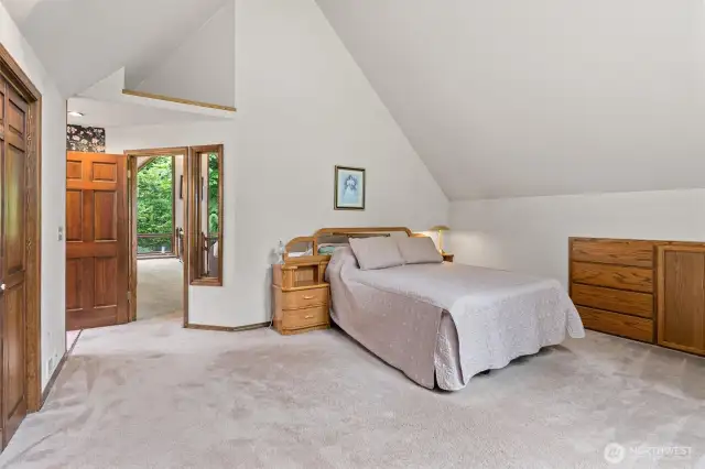 Private main suite with built-in wall dresser and drawer storage and updated ensuite bath