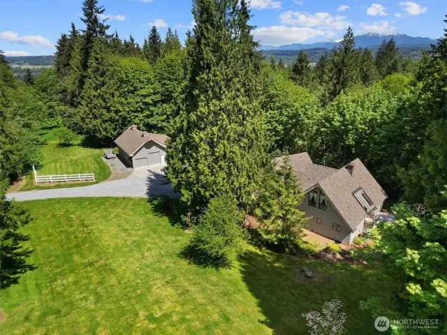 Welcome to Lord Hill! This stunning 2,560 Sqft home is nestled on a private 5-acre lot, featuring a 1,144 sq ft detached garage/shop and additional covered RV parking.