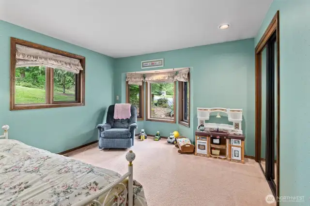 Additional bedroom with wood wrapped bay window