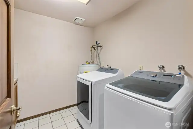 Large laundry room with built in storage