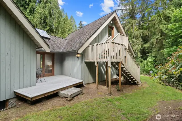 Additional deck and stairs that lead up to the bonus room above the attached garage