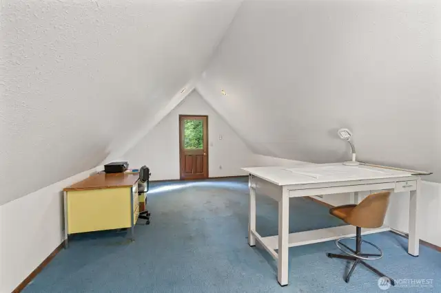 Bonus room above the attached garage, featuring a separate entrance with a dutch door and it's own wall heater