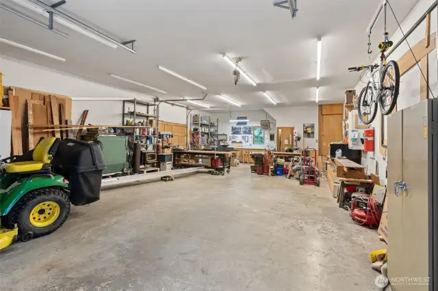 The detached 4-car garage/shop is 1,144 sq ft and features a pellet stove, 11 ft ceilings, a half bath, a upper storage loft with shelving, three doors (one 10’ and two 8’) and plenty of room for projects or storage