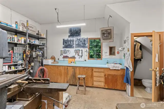 The detached 4-car garage/shop is 1,144 sq ft and features a pellet stove, 11 ft ceilings, a half bath, a upper storage loft with shelving, three doors (one 10’ and two 8’) and plenty of room for projects or storage