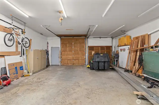 The detached 4-car garage/shop is 1,144 sq ft and features a pellet stove, 11 ft ceilings, a half bath, a upper storage loft with shelving, three doors (one 10’ and two 8’) and plenty of room for projects or storage