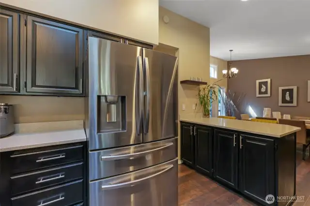 A closer look reveals the gleaming stainless-steel appliances and richly painted cabinets that complete the kitchen’s modern appeal. Whether cooking or entertaining, this kitchen is ready to perform.