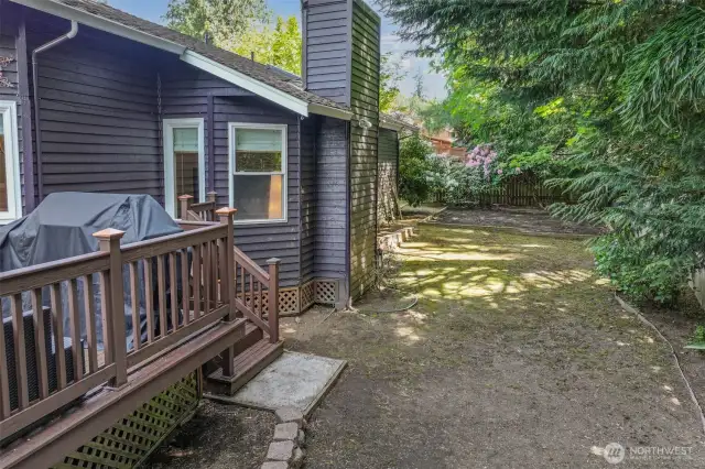 The fully fenced backyard features dappled shade, mature landscaping, and a blank canvas ready for lawn, play, or gardens. Enjoy privacy and room to personalize in this peaceful outdoor retreat.