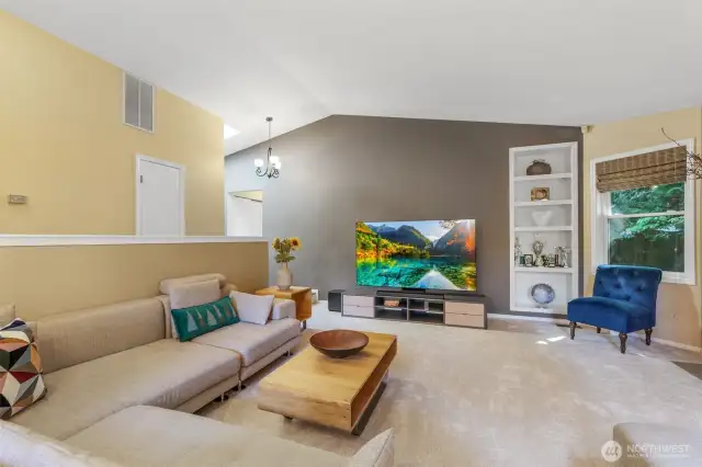 A different angle of the living space reveals the expansive layout, showcasing the home’s natural light and thoughtful design. The architectural lines and open shelving provide both style and functionality.