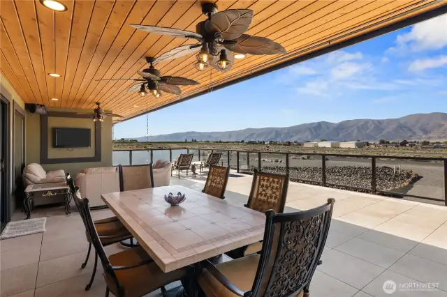 Covered back patio with views of Columbia River, Golf Course, Airstrip and mountains.