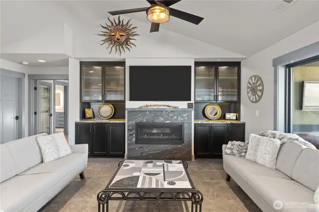 Living room with electric fireplace.