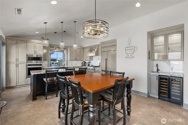 Dining room with wet bar area and wine fridge.