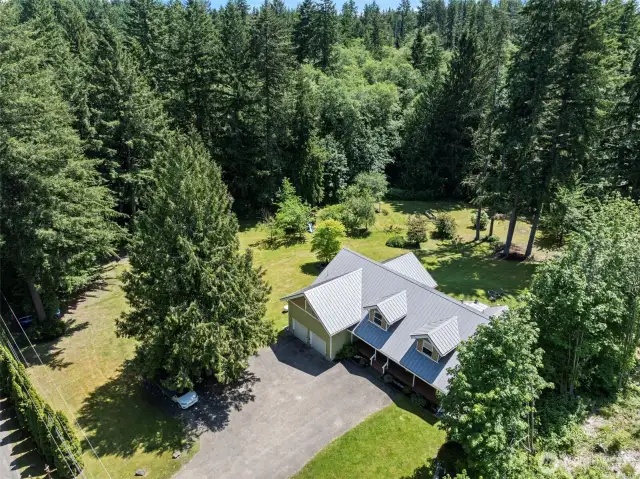Welcome to 3779 NE Wagon Wheel Lane. A beautiful peaceful retreat with over 2 acres of incredible privacy.