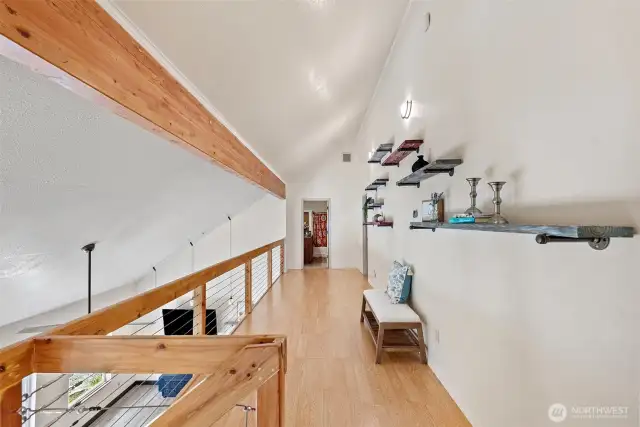 Look at that beautiful beam! This hallway leads to two guest bedrooms, a guest bathroom, and the oversized bonus room.