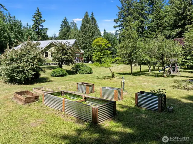 A garden paradise with plenty of sun. The orchard is a blend of pears, cherries, plums, apples, and blueberries, offering seasonal treats and a connection to the land that’s rare to find. Blackberries also grow wild along the furthest boundaries of the property.