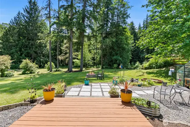 Enjoy coffee on one of the many outdoor spaces - covered front or back deck, or here with this beautiful expansive view.