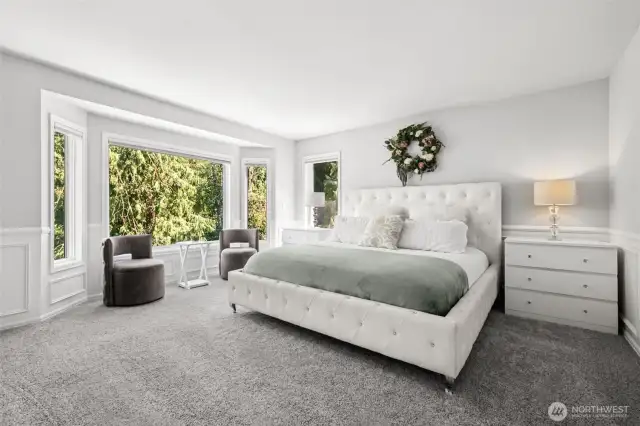 Elegant Primary Suite with Bay Window. Retreat to this luxurious primary bedroom featuring a plush carpet, and a stunning bay window nook with peaceful greenbelt views—perfect for reading or morning coffee.