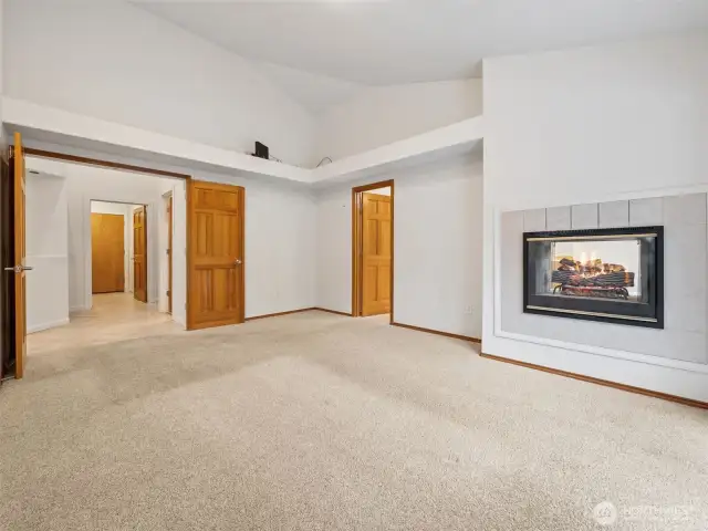 Primary Bedroom (on Main) w/ Deck Access, 5-piece en-suite, walk-in closet & fireplace