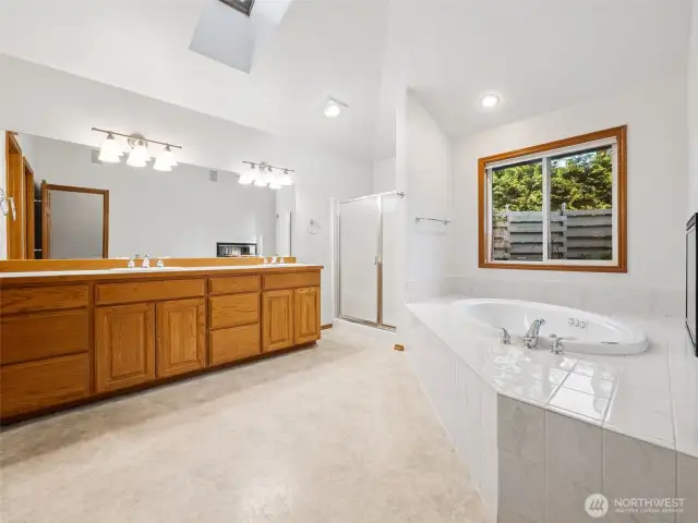 Primary 5-piece ensuite with soaking tub & fireplace