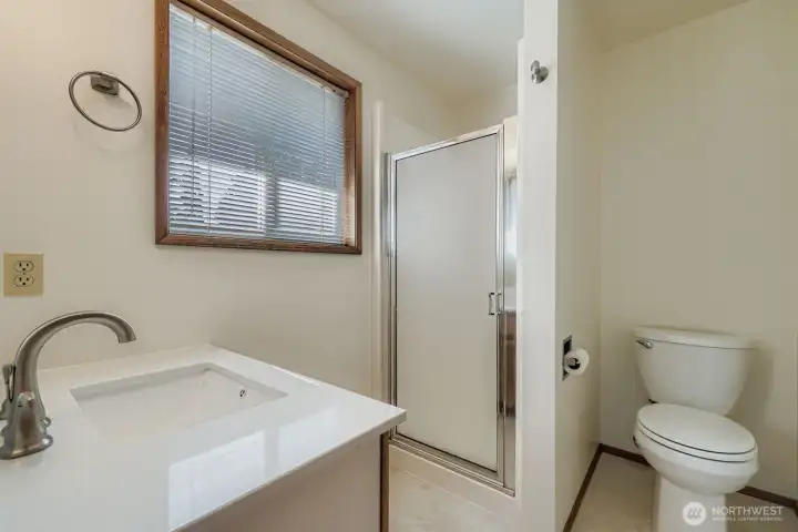 CONVENIENT AND PRIVATE BATHROOM OFF PRIMARY BEDROOM.