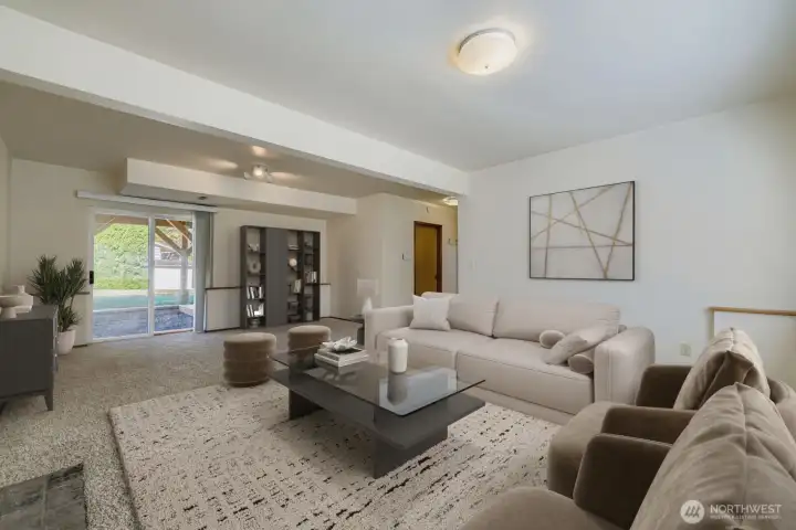 ENJOYABLE FAMILY ROOM ADJACENT HALF BATHROOM AND UTILITY ROOM.