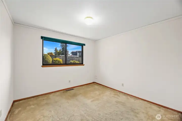 BEDROOM #3  Original hardwoods under carpet  Windows with views of rear yard   Floor to ceiling built in closet with storage cabinets