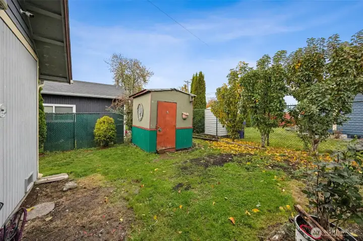 Storage shed included. Comes with fruit trees too!