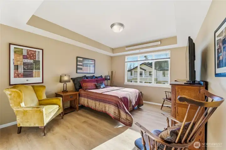 Primary suite with beautiful, updated ensuite bath features a step-in shower, large vanity with quartz counter and a walk-in closet.