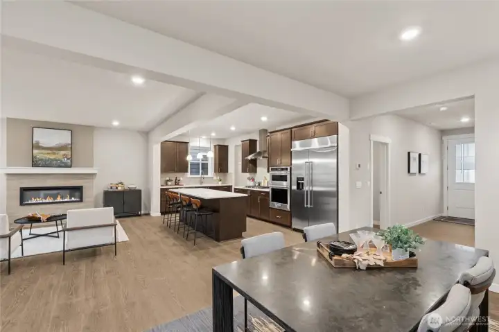 Large great room with spacious dining area adjoining beautifully appointed kitchen and family area. Materials, colors, and finishes will vary. See site agent for details