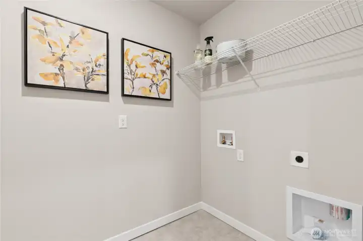 2nd floor utility room. Materials, colors, and finishes will vary. See site agent for details.