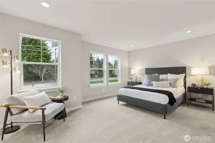 Primary bedroom with 5-piece attached bathroom and walk-in closet with loads of windows. Materials, colors, and finishes will vary. See site agent for details