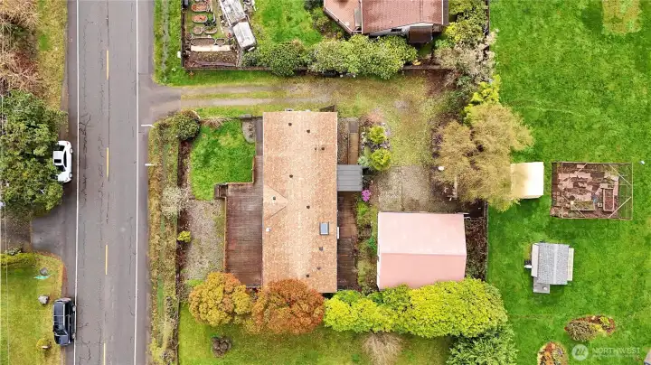 A great picture showing the home and the large detached 3 car garage with plenty of shop space as well.