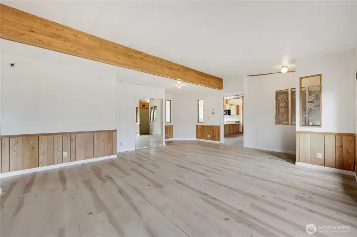 The coat closet has mirrored doors, the door goes to the family room, kitchen and primary suite.