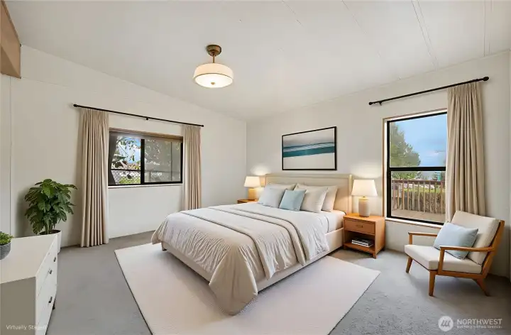 The virtually staged primary suite is very spacious.