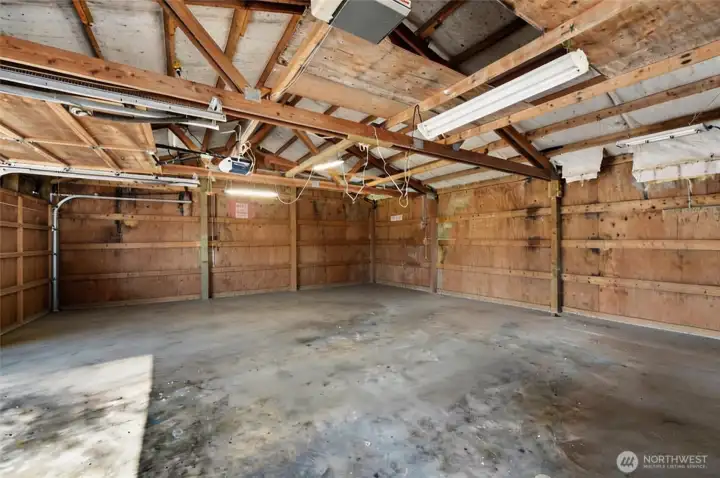 The inside view of the large 815 sq ft garage / shop. The pusses are endless!!
