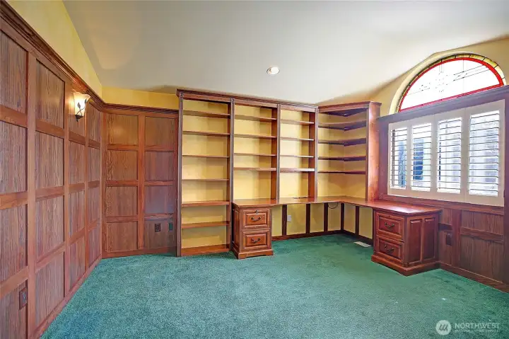 Classic study with rich woodwork and functional built-in features.