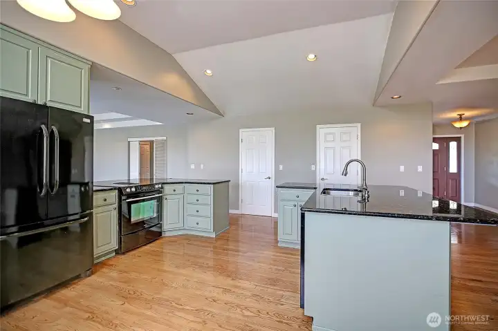 Well-designed kitchen featuring dual pantries for added convenience.